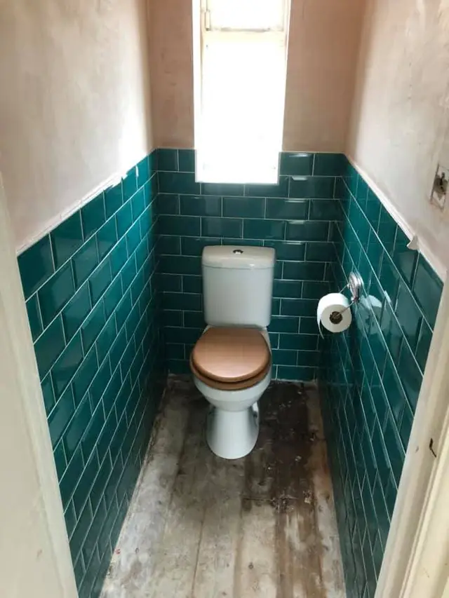 After: the separate toilet with teal metro tiles and a new toilet.